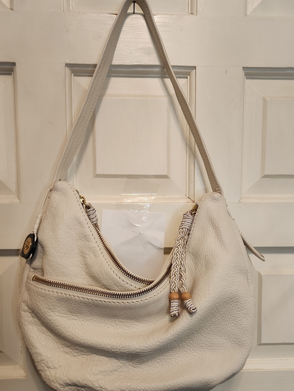 The Sak Cream Leather Zipper Shoulder Bag w/ Braided Tassel Middle Snap Closure